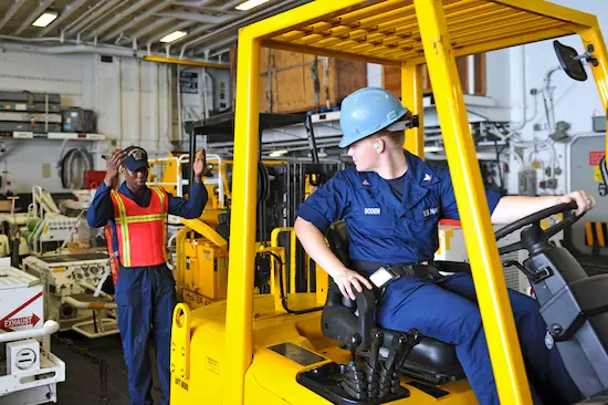 Technician configuring detection zones on forklift AI tablet calibration software